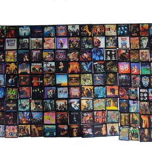 May include: A collection of square patches featuring album art from various rock and heavy metal bands. The patches display colorful album covers with band names and logos, showcasing a variety of musical styles and eras. The patches are arranged closely together.