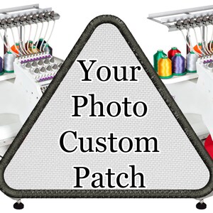 May include: A white triangular patch with black stitching around the edges. The patch has the text "Your Photo Custom Patch" printed in black.