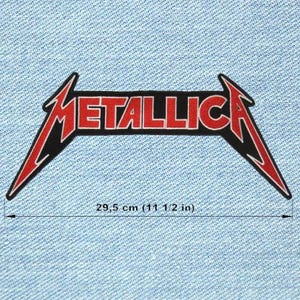 May include: A black and red Metallica logo patch, measuring 11 1/2 inches wide. The word "METALLICA" is in red block letters with a black outline. The logo is set against a light blue denim background.