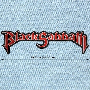 May include: Black Sabbath patch with the band's logo in red and black. The patch is 11 1/2 inches wide. The logo features a stylized font with a gothic aesthetic, set against a light blue denim background.