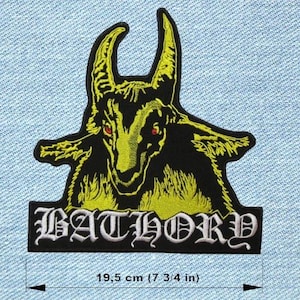 May include: Black and yellow embroidered patch featuring a goat-like creature with red eyes. The patch includes the word "BATHORY" in a gothic font. The patch measures 7 3/4 inches (19.5 cm) in width.