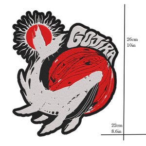 May include: Embroidered patch with a design featuring a red sun, a white creature, and the word "GOJIRA" in white. The patch is 26 cm high and 22 cm wide. The design is outlined in black.