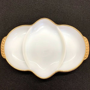 May include: White divided serving dish with a gold beaded rim. The dish has three sections.