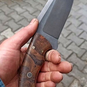 Walnut handle detail on No:52 designed for controlled outdoor and tracking tasks.