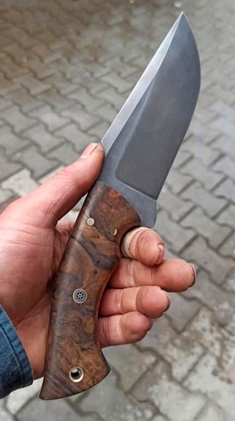 Walnut handle detail on No:52 designed for controlled outdoor and tracking tasks.