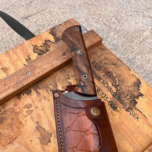 rugged sleipner tool steel blade in machete form highlighting wide chopper geometry