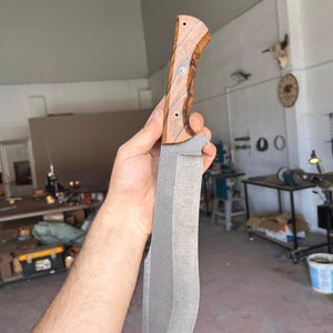 shoulder carry leather sheath designed for diagonal or backpack style carry shown with machete