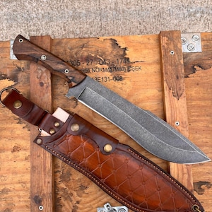 stonewashed sleipner steel machete displayed on wooden crate with handcrafted walnut handle
