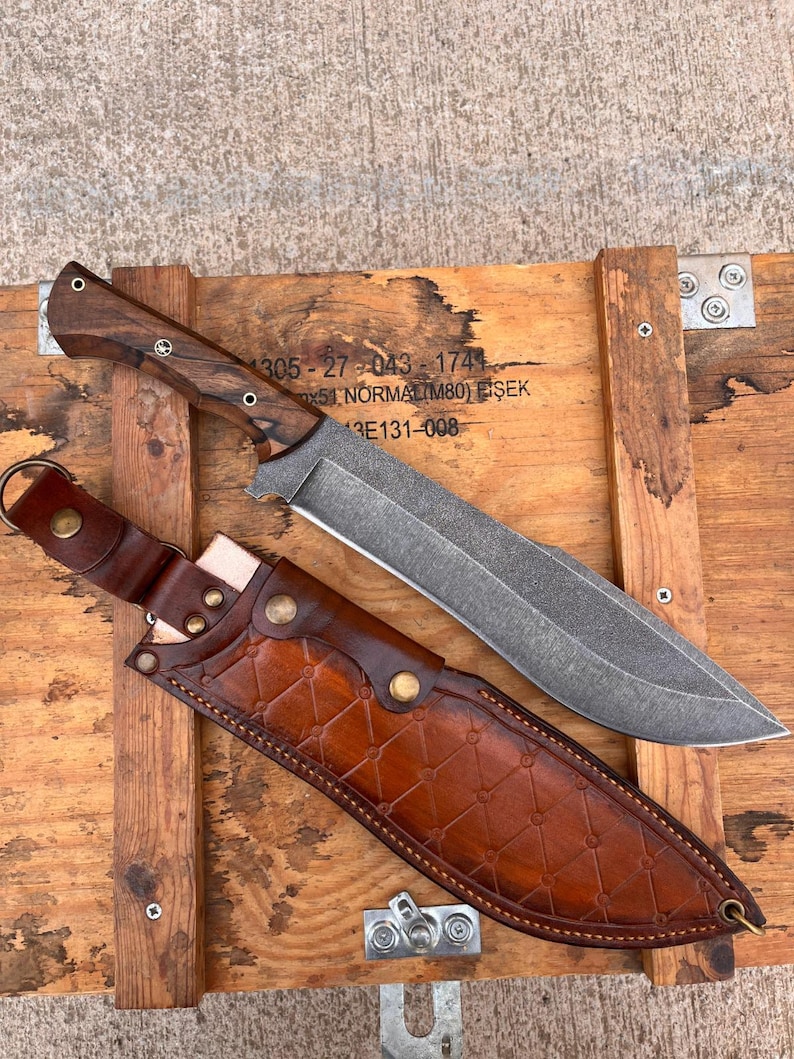 stonewashed sleipner steel machete displayed on wooden crate with handcrafted walnut handle