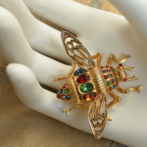 Vogue's golden vintage beetle insect seam brooch