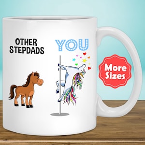 May include: White ceramic mug with a humorous design. The mug features a cartoon horse and a unicorn on a pole, with the words "OTHER STEPDADS" and "YOU". The design includes colorful stars and hearts. A red sticker says "More Sizes".