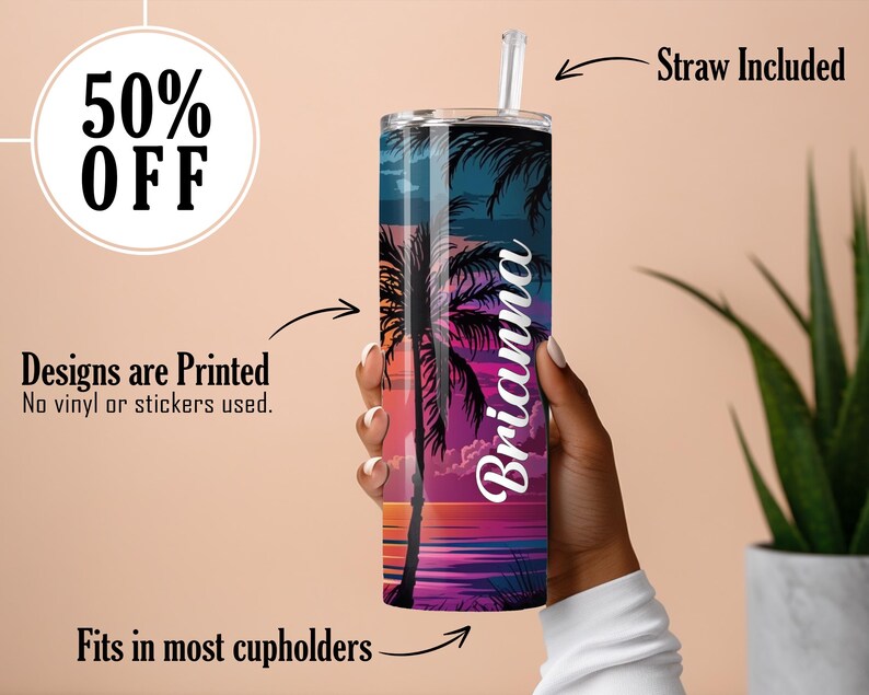 May include: A personalized stainless steel tumbler with a tropical sunset design and the name Brianna. The tumbler is in a hand and a straw is included.