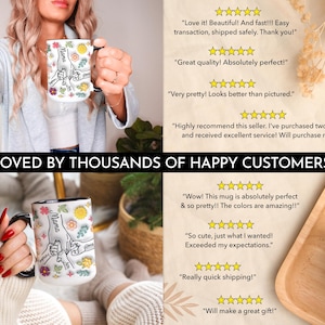 May include: White ceramic mug with a black handle. The mug features a floral design with the word "Mama" and a hand-drawn illustration of hands holding each other. The mug is surrounded by positive customer reviews.
