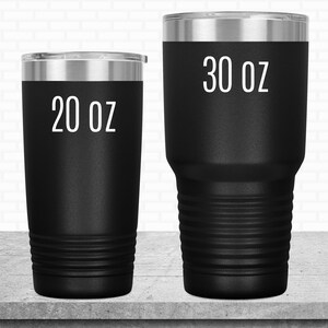 May include: Two black stainless steel tumblers with white text. The smaller tumbler is 20 oz and the larger tumbler is 30 oz.