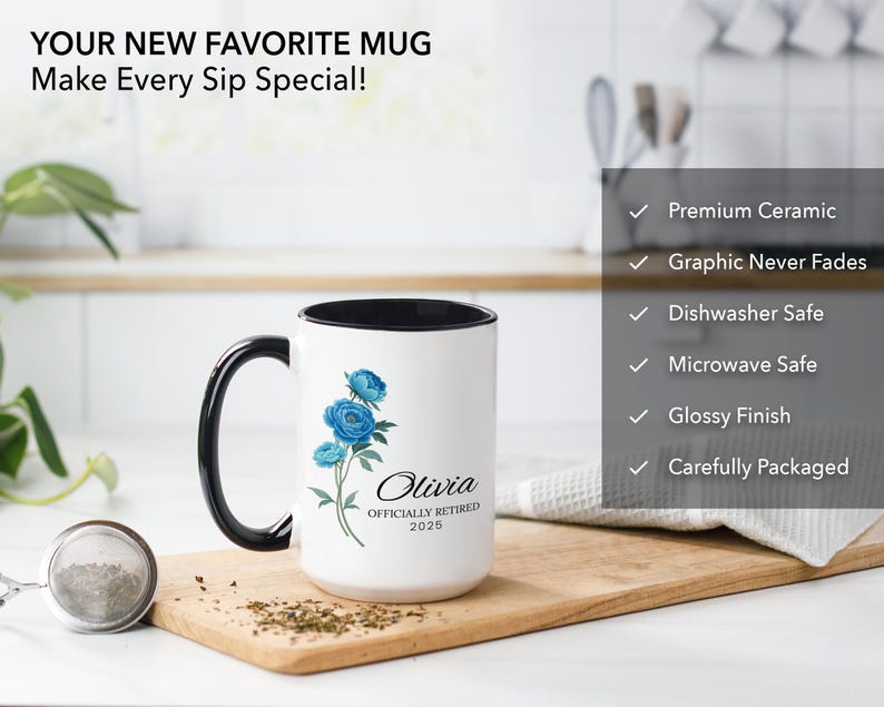 Puede incluir: Taza de cer&aacute;mica blanca con borde y asa negros. La taza presenta un dise&ntilde;o floral azul y el texto "Olivia Officially Retired 2025".