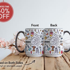 May include: White ceramic mug with a black handle and rim, featuring a colorful tool-themed design. The mug has the word "GRANDPA" and names printed on it. The image also includes the text "Printed on Both Sides" and "50% OFF".