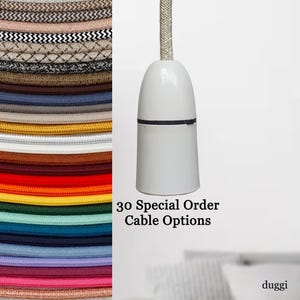 May include: A white pendant light fitting with a silver fabric cable. The image displays a selection of colourful electrical cords. Text on the image reads "30 Special Order Cable Options."