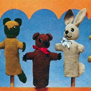 May include: Five crocheted finger puppets, including a dog, cat, bear, rabbit, and another animal. The puppets are all different colors and have different facial expressions.
