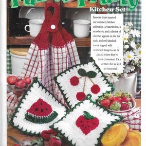 May include: Crochet kitchen set with a red and white checkered towel, a watermelon hot pad, a strawberry hot pad, and a cherry hot pad. The set is titled "Fun 'N' Fruity Kitchen Set".