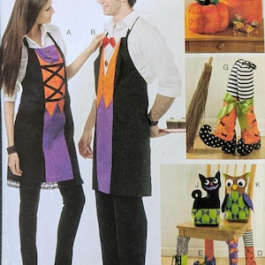 May include: A Halloween-themed image featuring aprons, decorative pumpkins, and chair leg covers. The aprons are black with purple and orange accents. The pumpkins are orange. Chair legs are decorated with witch legs, boots, and striped socks.