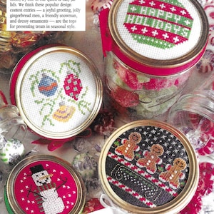 May include: Four different Christmas-themed designs for jar lids. The designs include a snowman, gingerbread men, ornaments, and a red and green ornament with the text "Happy Holidays".