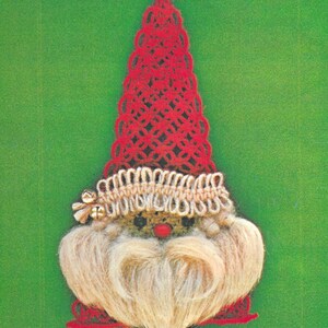 May include: A red and white crocheted gnome ornament with a white beard and a red hat. The gnome has a small red nose and black eyes. The ornament is hanging from a gold hook.