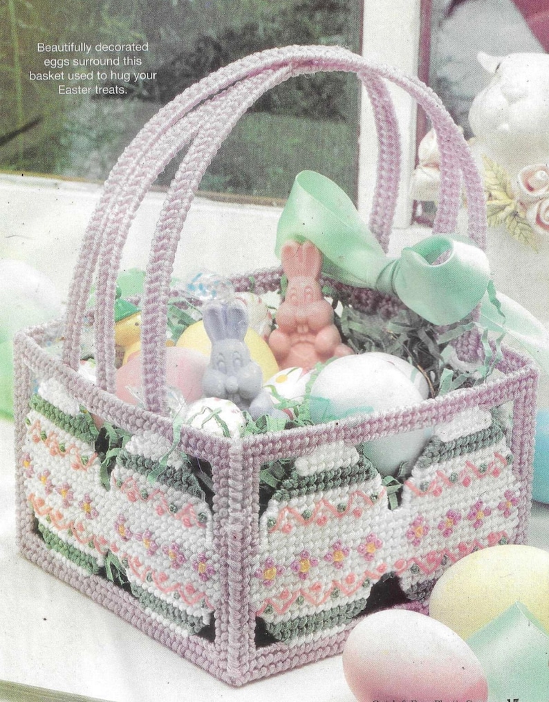 May include: A purple plastic Easter basket with a handle, decorated with pastel pink and green eggs. The basket is filled with pastel colored plastic eggs and bunny figurines.