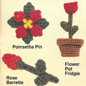 May include: A set of four plastic canvas crafts featuring a red poinsettia pin, a red rose barrette, a green flower stem in a brown pot, and the text "Poinsettia Pin", "Rose Barrette", "Flower Pot Fridgie".