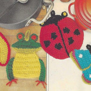 May include: Five crocheted pot holders in the shapes of an apple, a frog, a ladybug, a butterfly, and a flower. The pot holders are all made with colorful yarn and have a variety of textures.