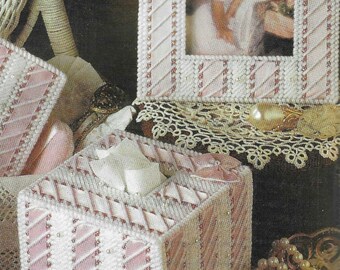 May include: A collection of handmade decorative items in a soft pink and white color scheme. Includes a photo frame, tissue box, and small box, all with a stitched pattern and pearl accents. A photo of a young girl is in the frame.