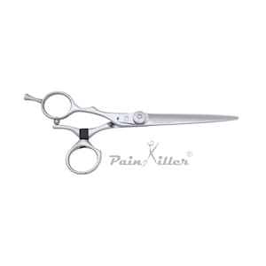May include: Silver-colored stainless steel hair cutting shears featuring an offset handle design, a black rubber finger rest, an adjustable tension screw, and a finger tang. The blade is engraved with the text Pain Killer with a scissor icon.