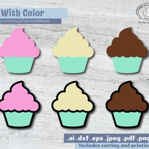 May include: Six cupcake SVG cut files, three in pink, yellow, and brown frosting, and three in the same colors but with a black outline. The text "6 With Color" and "etsy.com/shop/VeniceWaves" is at the top of the image. The text ".ai .dxf .eps .jpeg .pdf .png .svg" and "Includes cutting and printing files" is at the bottom of the image.