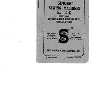 May include: A grey instruction manual for Singer sewing machines No. 201K. The cover features black text including INSTRUCTIONS FOR USING SINGER SEWING MACHINES, ROTATING HOOK, REVERSE FEED, FOR FAMILY USE, and THE SINGER MANUFACTURING CO. with a large S logo.