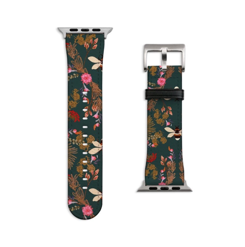 May include: A green Apple Watch band with a floral and bee pattern. The band is made of leather and has a silver buckle.