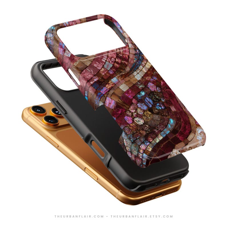 May include: A protective phone case featuring a vibrant mosaic pattern of deep red, burgundy, and iridescent blue tiles. The case is shown hovering above a gold-colored smartphone, displaying precise cutouts for the camera and side buttons.