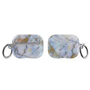 May include: A white and gold marble patterned case with a silver keychain for AirPods.