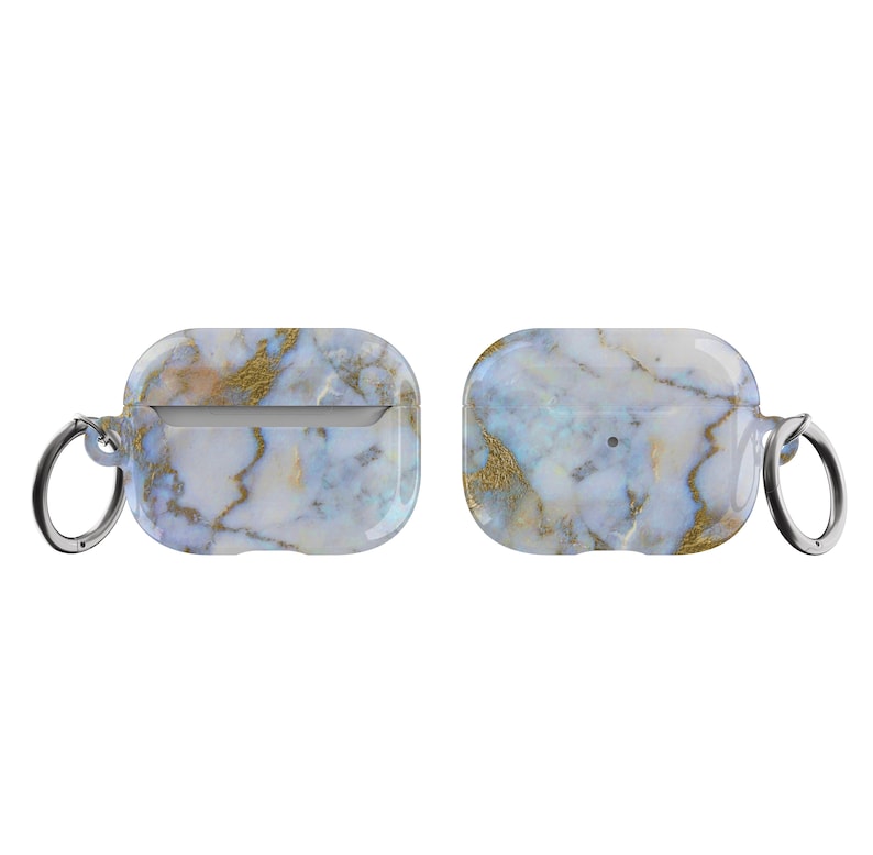 May include: A white and gold marble patterned case with a silver keychain for AirPods.