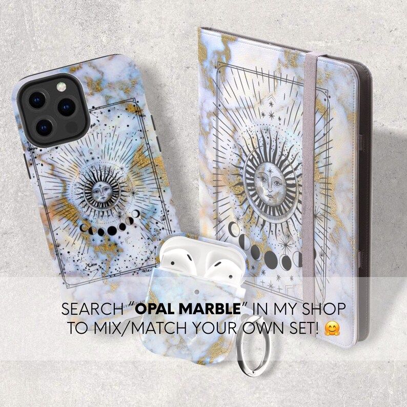 May include: A set of phone case, notebook, and Airpod case with a white marble background and gold accents. The design features a sun and moon with a celestial pattern. The text "SEARCH "OPAL MARBLE" IN MY SHOP TO MIX/MATCH YOUR OWN SET!" is visible in the image.