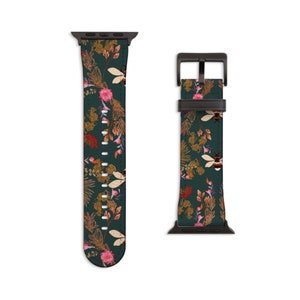 May include: A dark green Apple Watch band featuring a floral and bee design. The band is made of leather and has a black metal buckle.