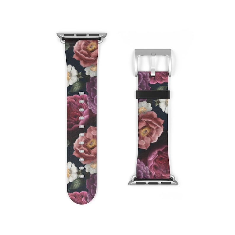 May include: A floral patterned Apple Watch band with a dark background and pink, red, and white flowers. The band is made of leather and has a silver buckle.