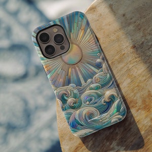 May include: A phone case with a colorful stained glass design featuring a sun and waves. The design is reminiscent of a seascape with a sun rising over the ocean. The case has a white background and the design is in shades of blue, green, and gold.