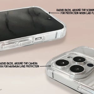 May include: A clear phone case with a marble design. The case has raised bezels around the screen and camera to protect the phone when dropped.