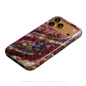 May include: A smartphone case featuring a mosaic pattern of iridescent shell fragments in shades of deep red, burgundy, and purple. The design includes small square and irregular pieces with a glossy finish, surrounding a gold-toned camera module.