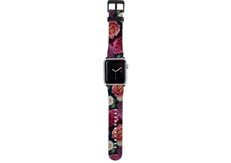 May include: A black watch band with a floral pattern featuring pink, red, and white flowers on a dark background.