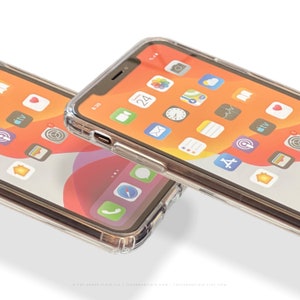 May include: Two clear phone cases with a black trim, showing the screen of an iPhone with a bright orange background and various app icons. The time is 8:39.