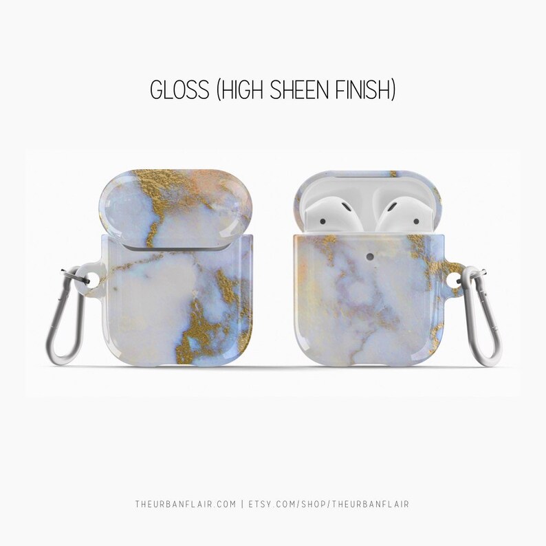May include: A white and gold marble patterned case for Apple AirPods with a carabiner clip. The case is open to show the AirPods inside. The text "GLOSS (HIGH SHEEN FINISH)" is at the top of the image.