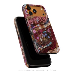 May include: A smartphone case featuring a vibrant mosaic pattern of iridescent, multi-colored tiles in shades of deep red, purple, and blue. The case has a solid orange camera housing area with three circular lens cutouts and a flash opening.