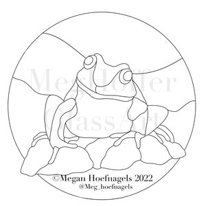 May include: A black and white line art illustration of a frog sitting on a rock. The frog is in a circle with a background of hills. The image includes the text "Megan Hoefnagels 2022 @Meg_hoefnagels (Watermarks removed after purchase)"