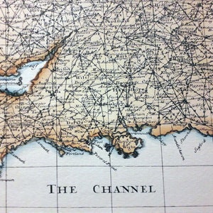 May include: An antique map of the southern coast of England, showing the counties of Devon, Somerset, Dorset, Wiltshire, Hampshire, Berkshire, Sussex, Kent, and Surrey. The map is printed in black and white on a cream-colored paper. The map includes the text "THE CHANNEL".