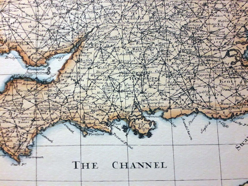 May include: An antique map of the southern coast of England, showing the counties of Devon, Somerset, Dorset, Wiltshire, Hampshire, Berkshire, Sussex, Kent, and Surrey. The map is printed in black and white on a cream-colored paper. The map includes the text "THE CHANNEL".